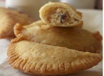 Gujiya (Baked whole wheat dessert with coconut and cottage cheese stuffing)